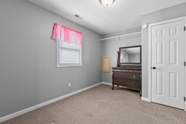 bedroom with light colored carpet