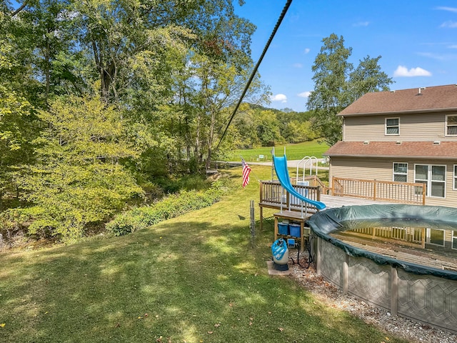 view of yard featuring a covered pool