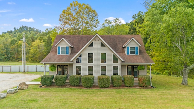 view of front facade featuring covered porch and a front yard