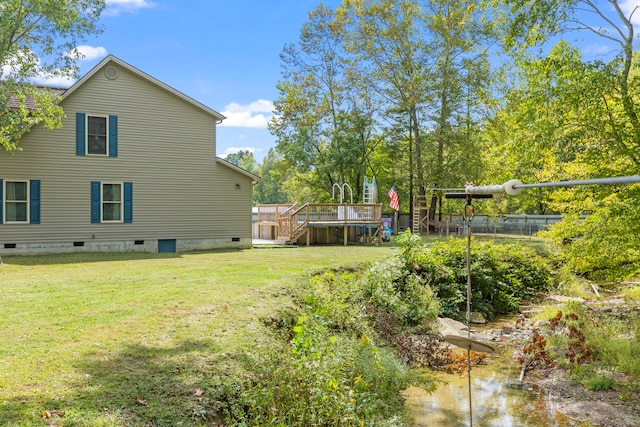 view of yard with a wooden deck