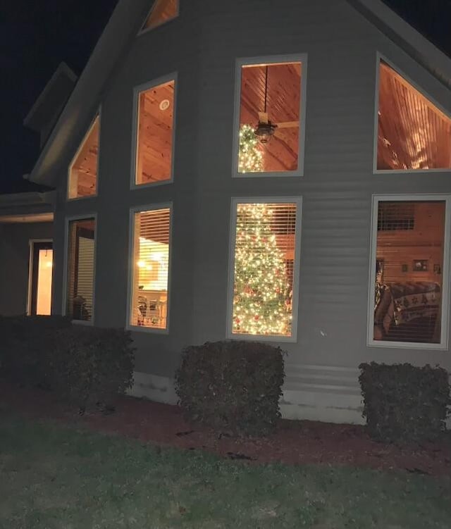 view of side of property featuring ceiling fan