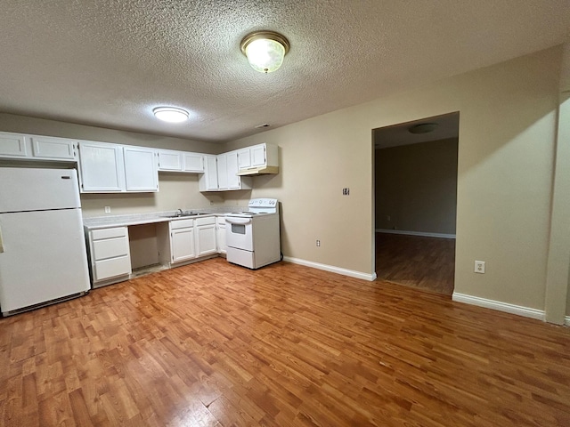 kitchen featuring a textured ceiling, white appliances, sink, light hardwood / wood-style floors, and white cabinetry