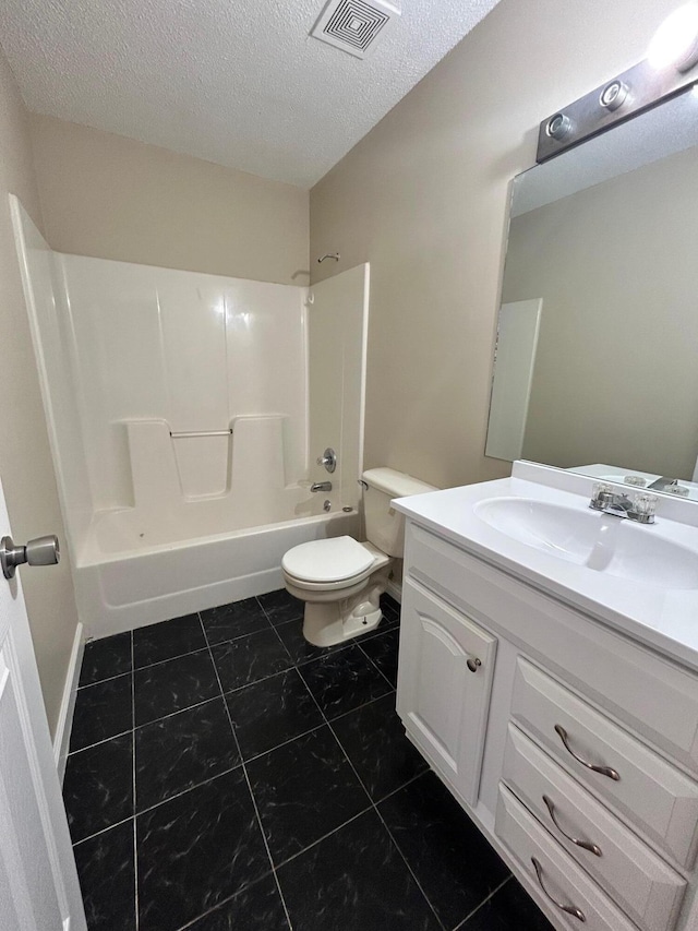 full bathroom featuring tile patterned floors, vanity, shower / bathing tub combination, toilet, and a textured ceiling