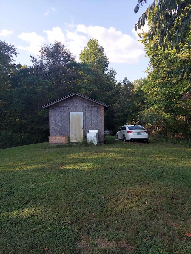 view of outdoor structure with a lawn