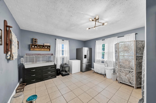 interior space with a textured ceiling, plenty of natural light, and toilet