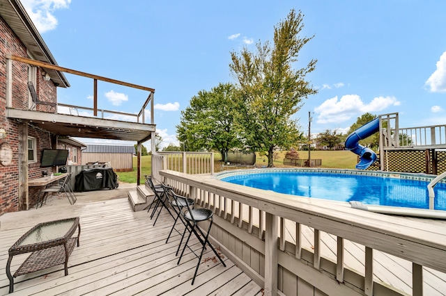 view of swimming pool featuring a wooden deck