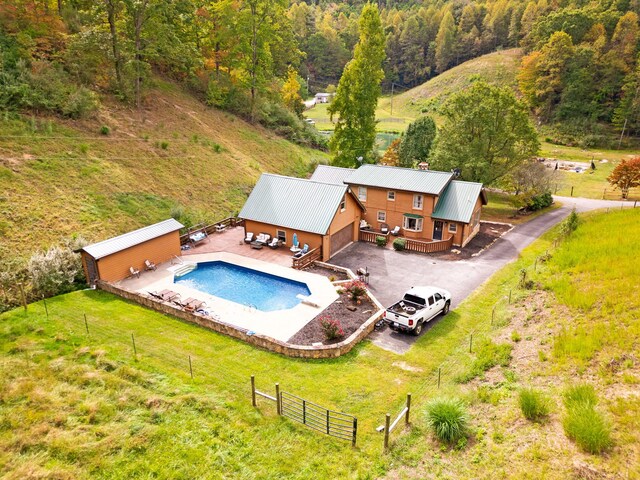 view of pool featuring a yard