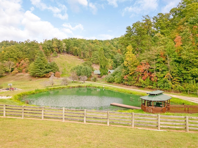 view of yard featuring a water view and a gazebo