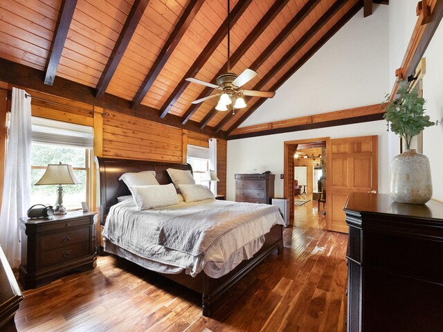 bedroom featuring beamed ceiling, hardwood / wood-style flooring, high vaulted ceiling, ceiling fan, and wooden ceiling