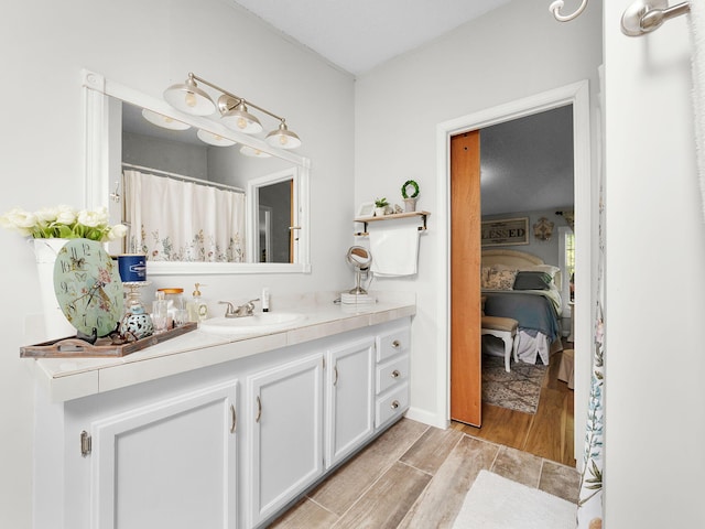 bathroom with wood-type flooring and vanity