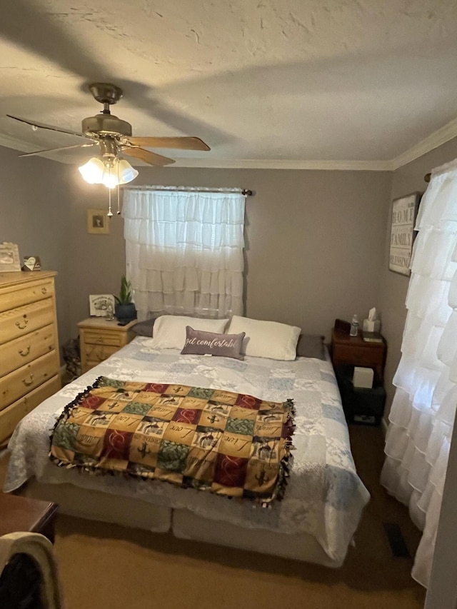 bedroom with crown molding and a ceiling fan