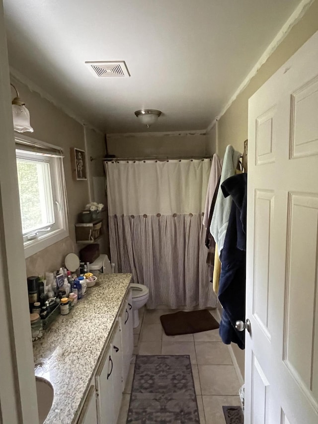 full bath with vanity, curtained shower, tile patterned flooring, toilet, and visible vents