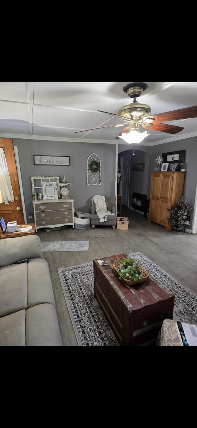 living room with wood finished floors and ceiling fan