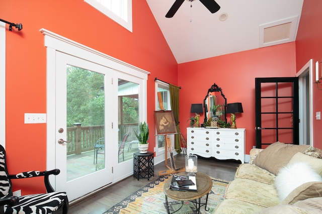 living room featuring lofted ceiling, ceiling fan, and wood-type flooring