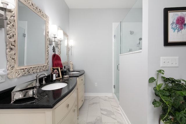 bathroom featuring vanity and an enclosed shower