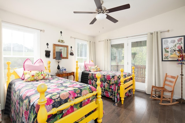 bedroom with ceiling fan, access to exterior, dark wood-type flooring, and multiple windows