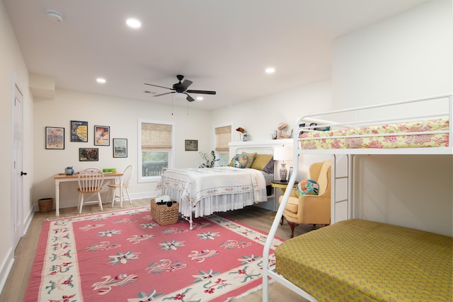 bedroom with hardwood / wood-style floors and ceiling fan