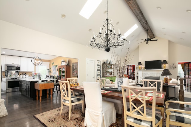 dining space with ceiling fan, beamed ceiling, a healthy amount of sunlight, and dark hardwood / wood-style floors