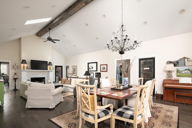 dining space with high vaulted ceiling, ceiling fan, a fireplace, beam ceiling, and dark hardwood / wood-style flooring