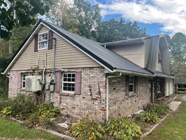 view of side of property featuring ac unit