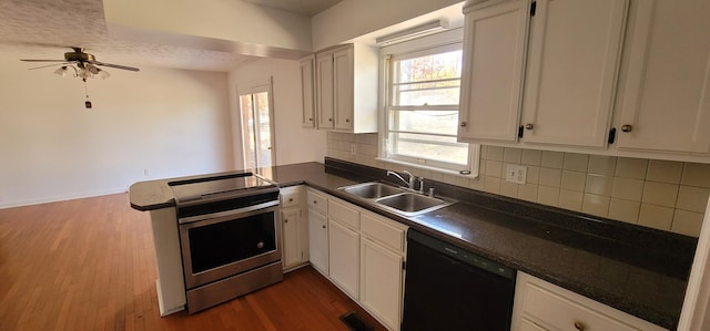 kitchen featuring kitchen peninsula, black dishwasher, white cabinetry, and electric stove