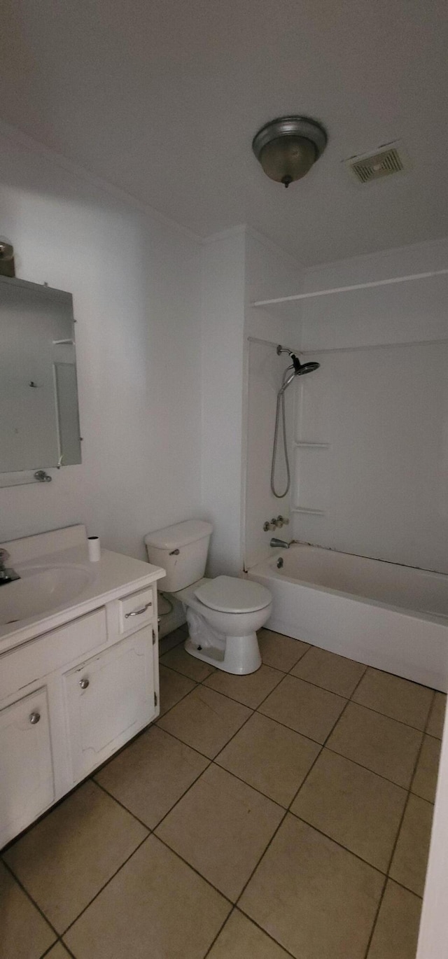 full bathroom with tile patterned floors, bathing tub / shower combination, vanity, and toilet