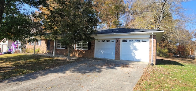 view of front of home with a garage and a front lawn