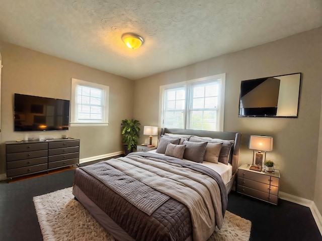 carpeted bedroom featuring a textured ceiling