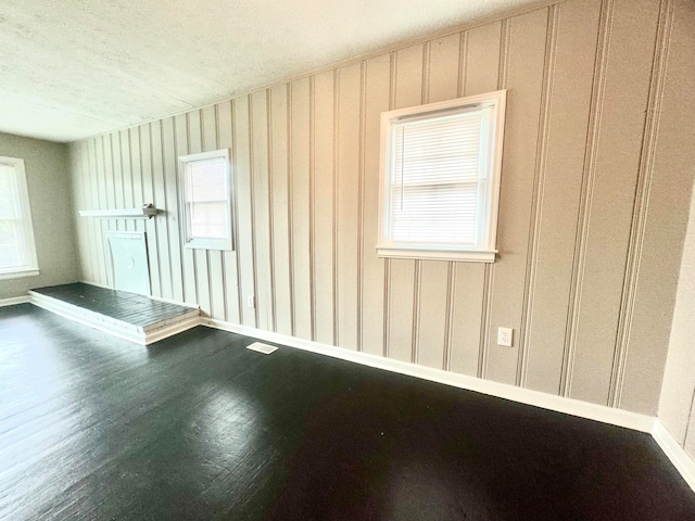 unfurnished room featuring wood-type flooring