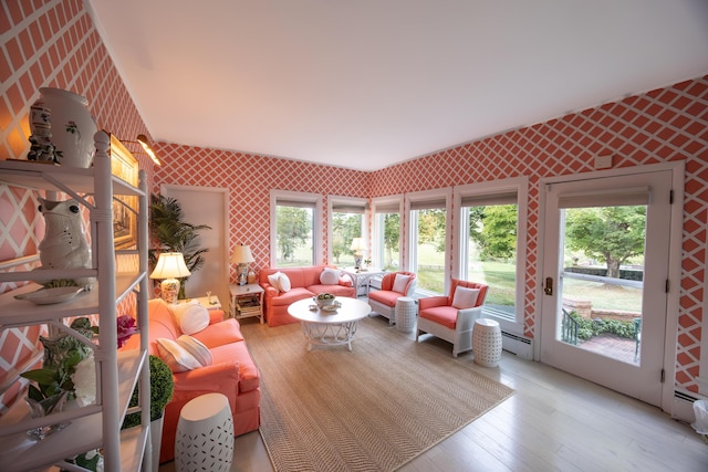3521 Bryan Station Rd, Lexington, KY 40516 - living room featuring wallpapered walls, light wood-style floors, and a baseboard heating unit