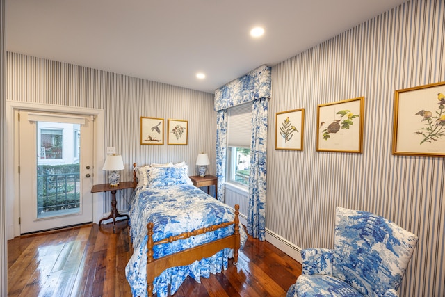 bedroom featuring access to outside and dark hardwood / wood-style floors