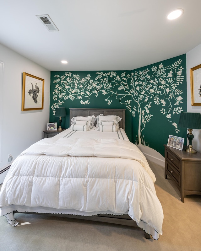 carpeted bedroom with a baseboard heating unit