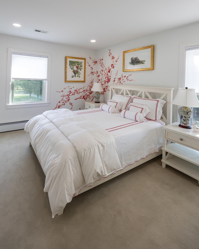 bedroom featuring carpet floors and baseboard heating