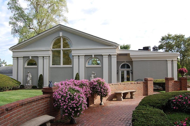 3521 Bryan Station Rd, Lexington, KY 40516 - greek revival inspired property featuring stucco siding