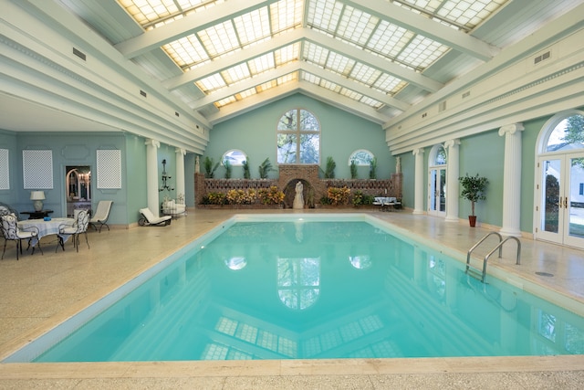 view of swimming pool featuring a skylight