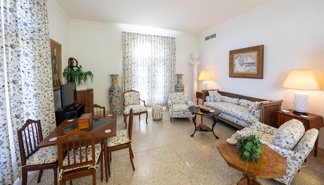 living room featuring crown molding