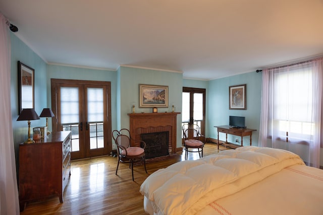 3521 Bryan Station Rd, Lexington, KY 40516 - bedroom featuring french doors, access to outside, wood finished floors, crown molding, and a fireplace