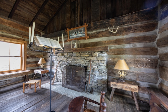 unfurnished living room featuring wood ceiling, wood-type flooring, high vaulted ceiling, and a fireplace