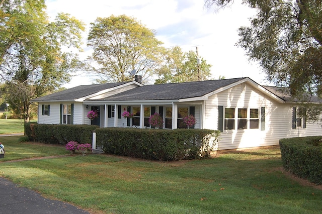 ranch-style house with a front lawn