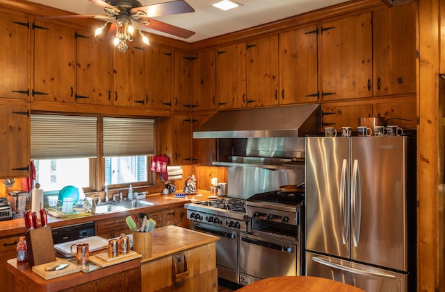 3521 Bryan Station Rd, Lexington, KY 40516 - kitchen featuring appliances with stainless steel finishes, exhaust hood, ceiling fan, and brown cabinets
