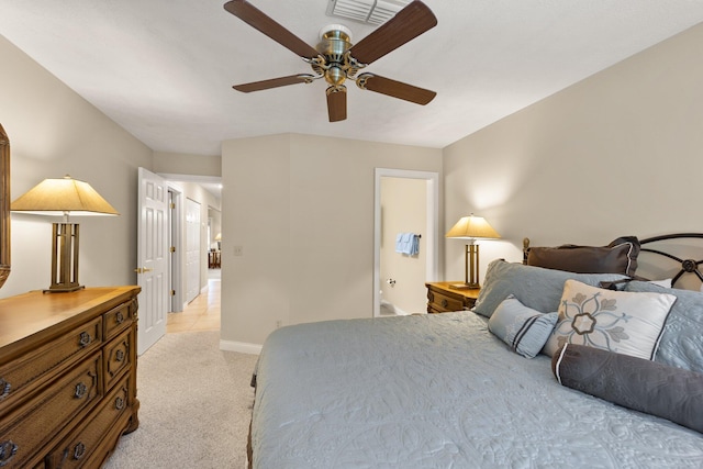 bedroom with ceiling fan and light carpet