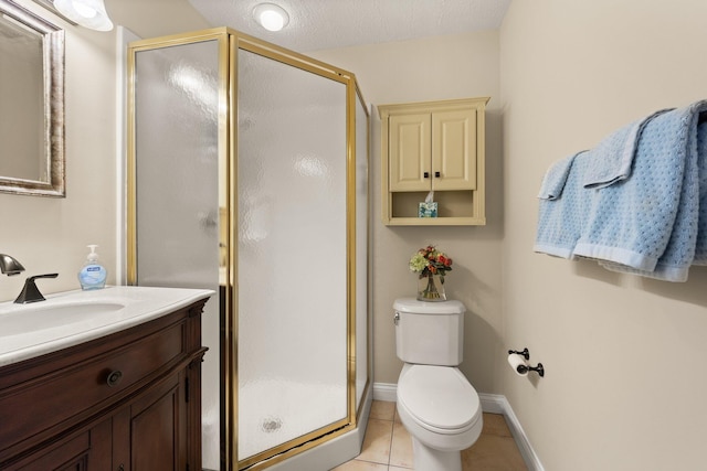 bathroom featuring tile patterned flooring, a textured ceiling, a shower with shower door, vanity, and toilet