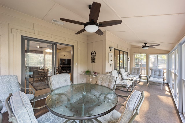 interior space featuring vaulted ceiling and ceiling fan