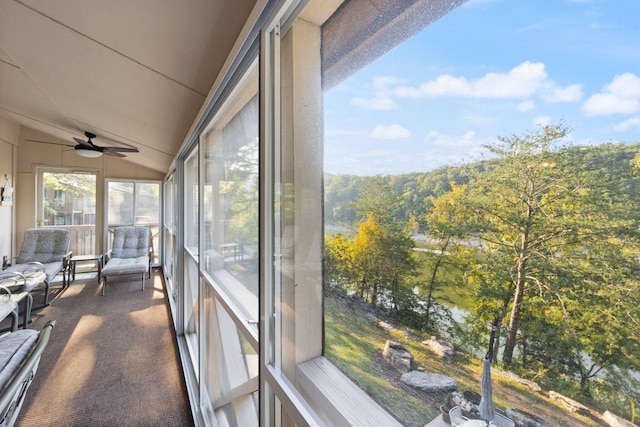 sunroom / solarium featuring vaulted ceiling and ceiling fan