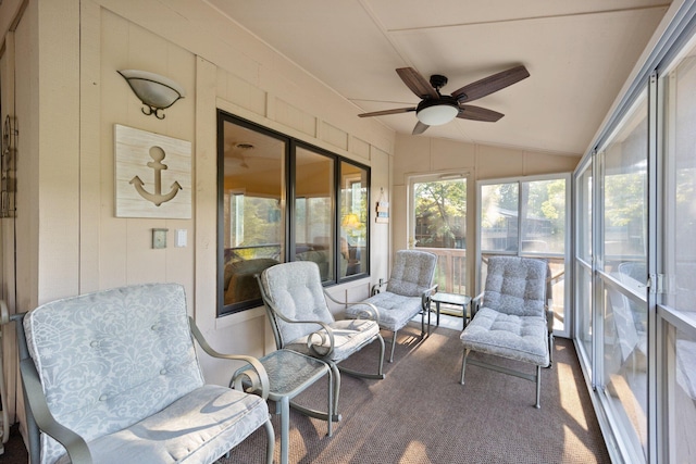 sunroom / solarium with ceiling fan and vaulted ceiling