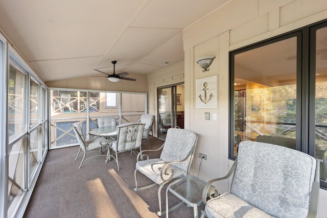 sunroom with vaulted ceiling and ceiling fan