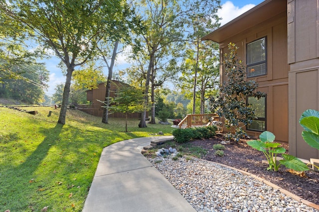 exterior space with a wooden deck and a yard