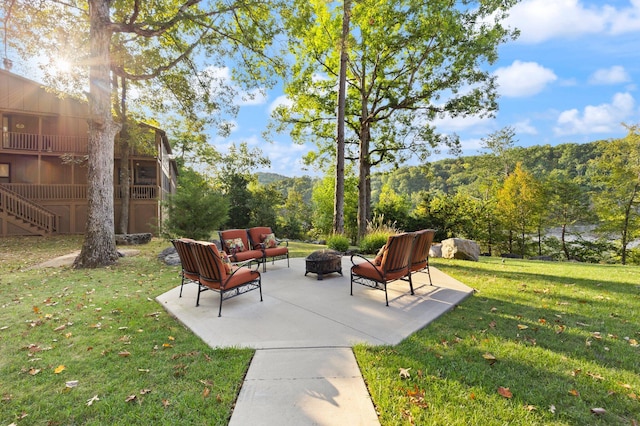 view of yard with outdoor lounge area and a patio area