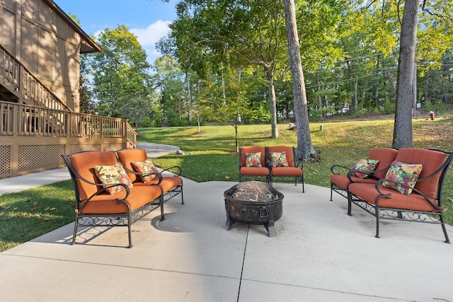 view of patio featuring an outdoor living space with a fire pit and a wooden deck