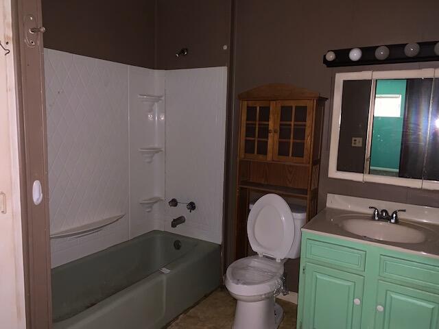 full bathroom with shower / bathtub combination, vanity, and toilet